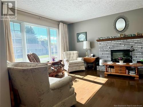 107 Ferguson Street, Miramichi, NB - Indoor Photo Showing Living Room With Fireplace