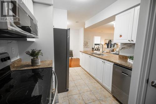 2831 - 3888 Duke Of York Boulevard, Mississauga, ON - Indoor Photo Showing Kitchen With Double Sink