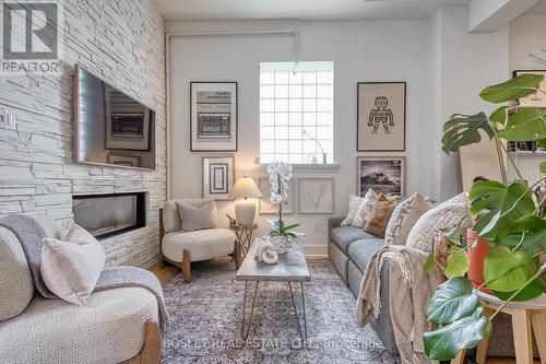 204 - 99 Chandos Avenue, Toronto, ON - Indoor Photo Showing Living Room With Fireplace