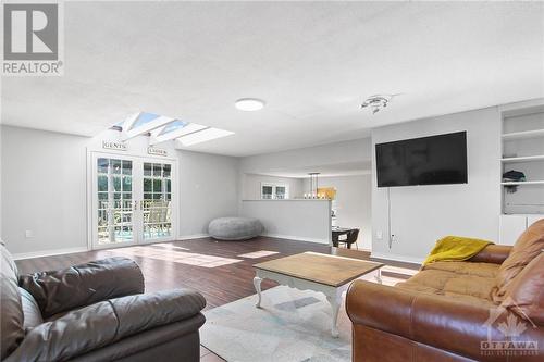 Huge family room with double doors leading to deck - 14 Langholm Crescent, Ottawa, ON - Indoor Photo Showing Living Room