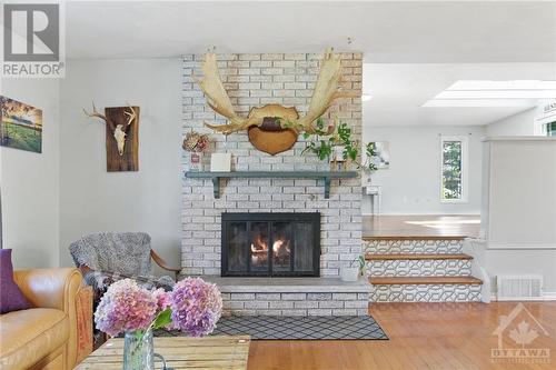 Floor to ceiling fireplace with mantle - 14 Langholm Crescent, Ottawa, ON - Indoor Photo Showing Living Room With Fireplace