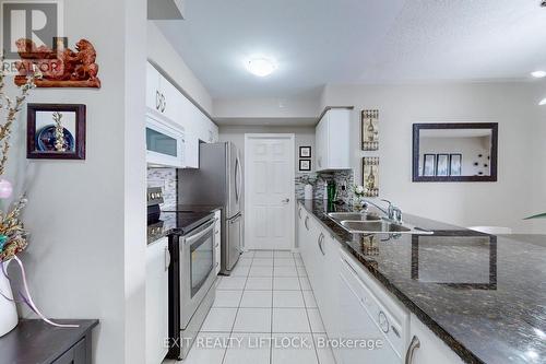 423 - 10 Mendelssohn Street, Toronto (Clairlea-Birchmount), ON - Indoor Photo Showing Kitchen With Double Sink