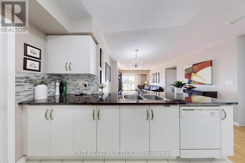 423 - 10 Mendelssohn Street, Toronto (Clairlea-Birchmount), ON - Indoor Photo Showing Kitchen With Double Sink