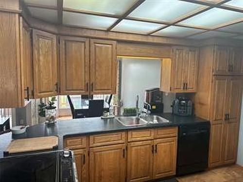 245 Swan River Drive, Swan River, MB - Indoor Photo Showing Kitchen With Double Sink