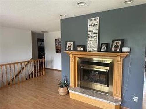 245 Swan River Drive, Swan River, MB - Indoor With Fireplace