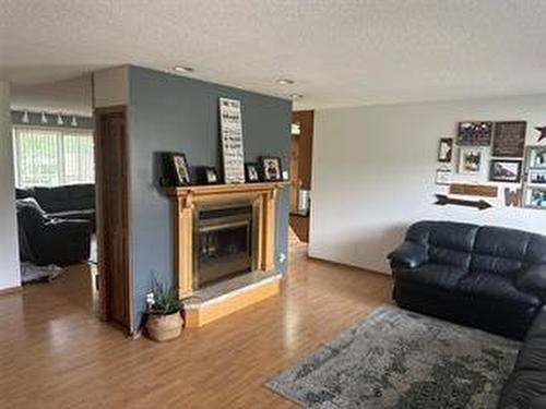 245 Swan River Drive, Swan River, MB - Indoor Photo Showing Living Room With Fireplace