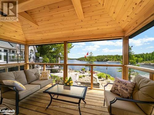 254G X-Bay Road, Killarney, ON - Indoor Photo Showing Living Room With Body Of Water