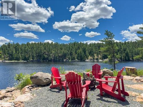 Firepit area - 254G X-Bay Road, Alban, ON - Outdoor With Body Of Water With View