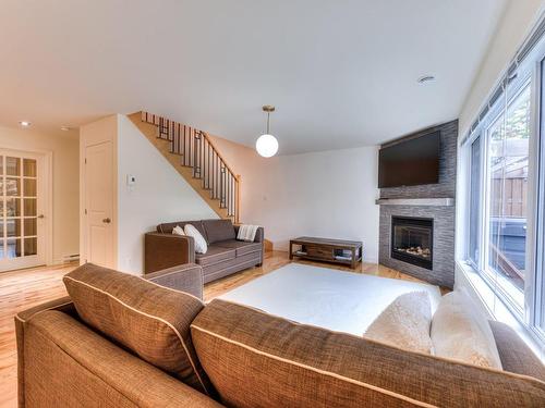 Living room - 600 Ch. Olivier, Saint-Côme, QC - Indoor Photo Showing Living Room With Fireplace