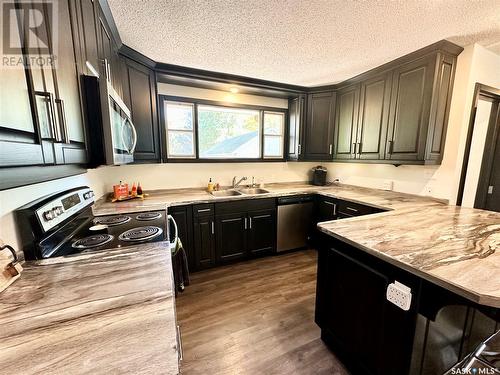 1512 106Th Street, North Battleford, SK - Indoor Photo Showing Kitchen With Double Sink