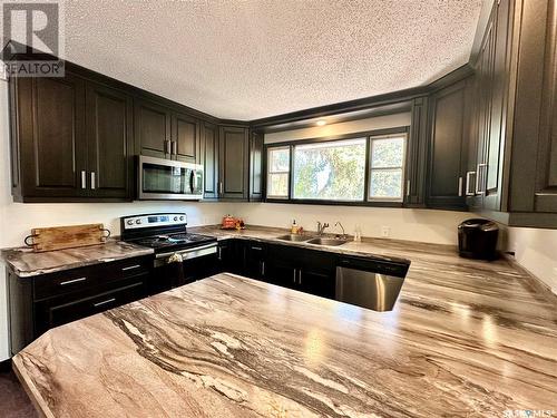 1512 106Th Street, North Battleford, SK - Indoor Photo Showing Kitchen With Double Sink