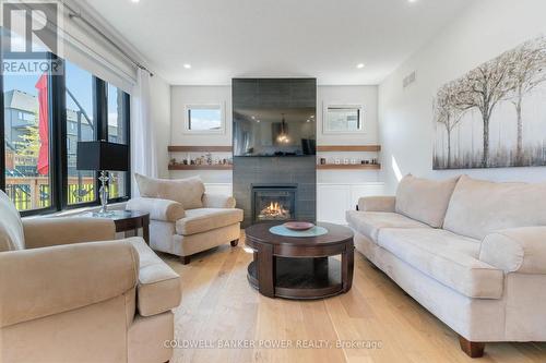 1056 Trailsway Avenue, London, ON - Indoor Photo Showing Living Room With Fireplace