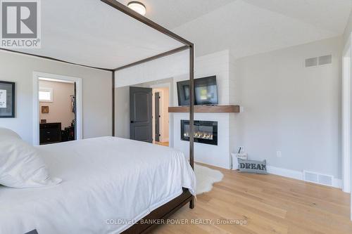 1056 Trailsway Avenue, London, ON - Indoor Photo Showing Bedroom With Fireplace