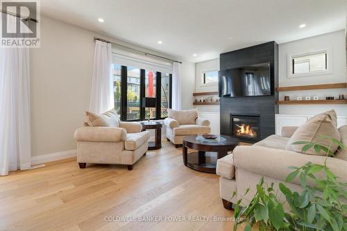 1056 Trailsway Avenue, London, ON - Indoor Photo Showing Living Room With Fireplace