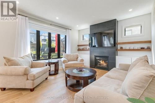 1056 Trailsway Avenue, London, ON - Indoor Photo Showing Living Room With Fireplace