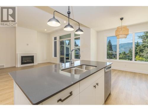 111 20 Street Se, Salmon Arm, BC - Indoor Photo Showing Kitchen With Fireplace With Double Sink