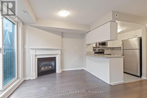 1019 - 18 Laidlaw Street, Toronto, ON - Indoor Photo Showing Other Room With Fireplace