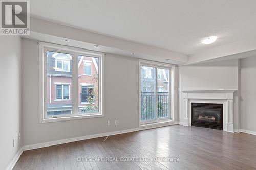 1019 - 18 Laidlaw Street, Toronto, ON - Indoor Photo Showing Living Room With Fireplace