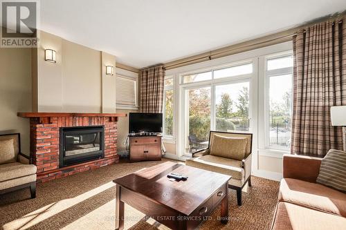 120 - 125 Fairway Court, Blue Mountains, ON - Indoor Photo Showing Living Room With Fireplace