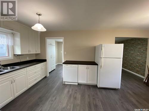 203 1St Avenue E, Kindersley, SK - Indoor Photo Showing Kitchen With Double Sink