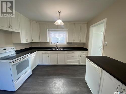 203 1St Avenue E, Kindersley, SK - Indoor Photo Showing Kitchen With Double Sink