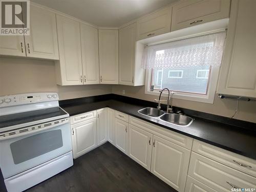 203 1St Avenue E, Kindersley, SK - Indoor Photo Showing Kitchen With Double Sink