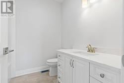 4-piece main floor bathroom with full bathtub & quartz countertops that match those in ensuite bath, lower level bath and kitchen countertops - 