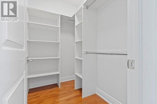 Walk-in closet in primary bedroom with closet organizers included. - 9 Billings Avenue W, South Dundas, ON - Indoor With Storage