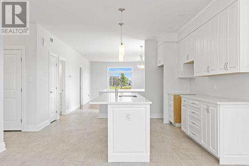 Living/Kitchen-Note crown moulding extending to ceiling from top of cabinets - 9 Billings Avenue W, South Dundas, ON - Indoor Photo Showing Kitchen