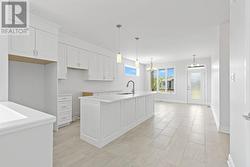 Kitchen/Dining area that extends towards front door. - 