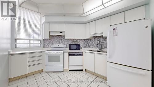 2001 - 4725 Sheppard Avenue E, Toronto, ON - Indoor Photo Showing Kitchen With Double Sink