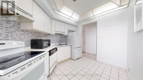 2001 - 4725 Sheppard Avenue E, Toronto, ON - Indoor Photo Showing Kitchen With Double Sink