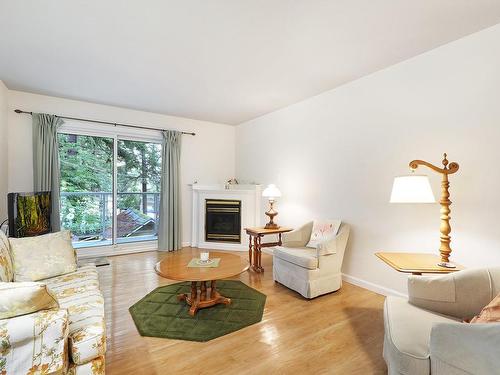 206-1970 Comox Ave, Comox, BC - Indoor Photo Showing Living Room With Fireplace