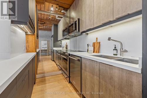 109 - 993 Queen Street W, Toronto, ON - Indoor Photo Showing Kitchen With Double Sink