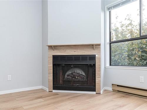 210-2815 Departure Bay Rd, Nanaimo, BC - Indoor Photo Showing Living Room With Fireplace