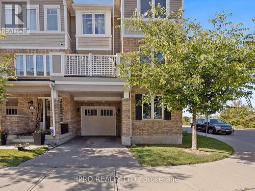 1 - 1025 Nadalin Heights, Milton, ON - Outdoor With Balcony With Facade