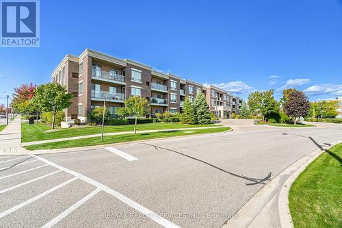 318 - 65 Via Rosedale, Brampton, ON - Outdoor With Facade