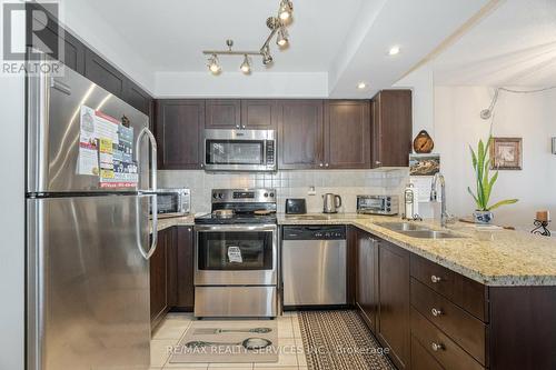 318 - 65 Via Rosedale, Brampton, ON - Indoor Photo Showing Kitchen With Double Sink