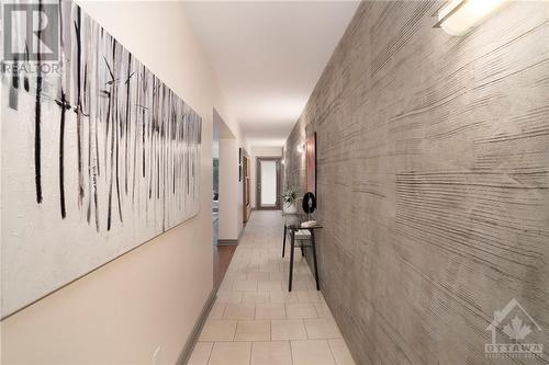 Cool textured concrete gallery wall in the entrance - 474 Sunnyside Avenue, Ottawa, ON - Indoor Photo Showing Other Room