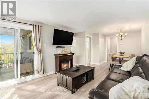 314 - 6434 Bilberry Drive, Ottawa, ON - Indoor Photo Showing Living Room With Fireplace