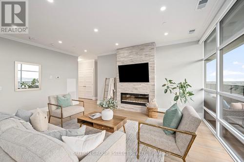 1001 - 460 Callaway Road, London, ON - Indoor Photo Showing Living Room With Fireplace