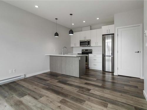 303-1515 Redfern St, Victoria, BC - Indoor Photo Showing Kitchen With Stainless Steel Kitchen