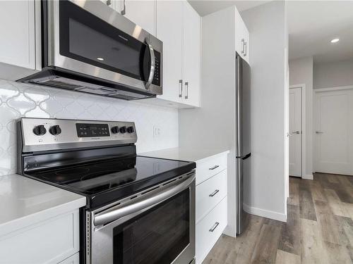 303-1515 Redfern St, Victoria, BC - Indoor Photo Showing Kitchen With Stainless Steel Kitchen