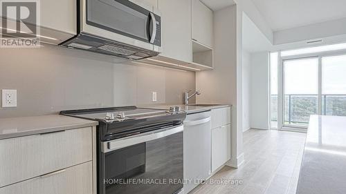 801 - 202 Burnhamthorpe Road E, Mississauga, ON - Indoor Photo Showing Kitchen