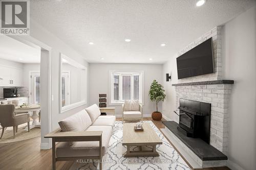 Upper - 26 Newman Court, Brampton, ON - Indoor Photo Showing Living Room With Fireplace