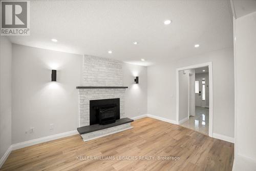 Upper - 26 Newman Court, Brampton, ON - Indoor Photo Showing Living Room With Fireplace