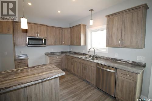 154 Heritage Landing Crescent, Battleford, SK - Indoor Photo Showing Kitchen With Double Sink