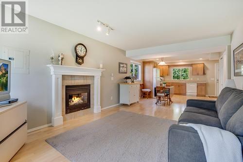 4275 Simeon Court, Kelowna, BC - Indoor Photo Showing Living Room With Fireplace