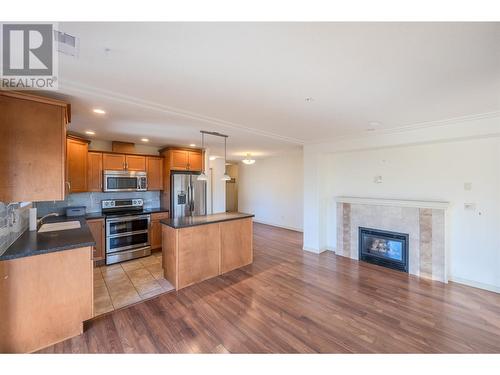 2125 Atkinson Street Unit# 805, Penticton, BC - Indoor Photo Showing Kitchen With Fireplace With Stainless Steel Kitchen