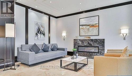 102 - 88 Promenade Circle, Vaughan, ON - Indoor Photo Showing Living Room With Fireplace